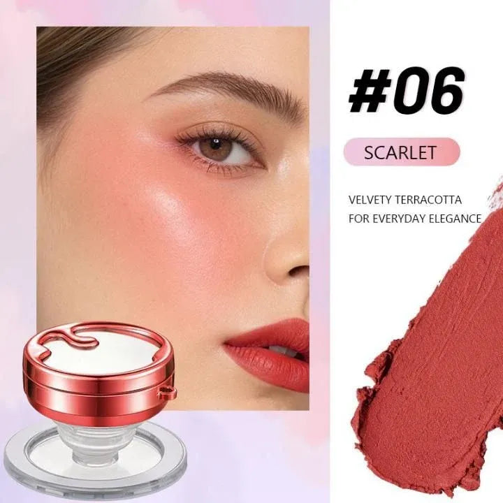 A cosmetic product shade card showing a close-up of a model's face with pink blush on the cheek, a swatch of the product on the right labeled '#06 SCARLET', and the compact itself at the bottom left on a pale pink background.