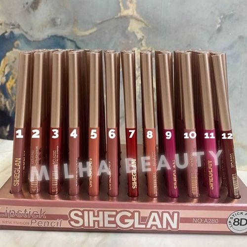 A set of 12 Sheeglan lipsticks arranged in a display box, numbered 1 to 12, showing a gradient of lip colors from nude beige to deep berry purple. The packaging is metallic rose gold with white branding.