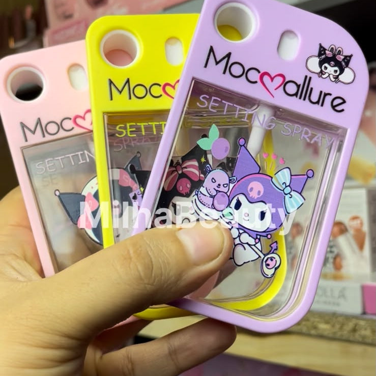 Hand holding a pink 'Mocmallure' product with cartoon character design, displayed on a smartphone screen.