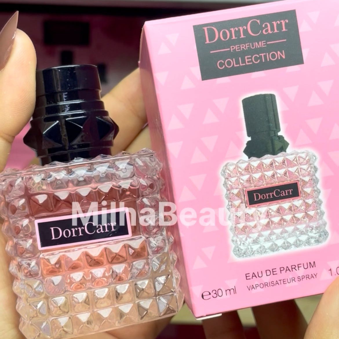 DorrCarr perfume bottle and packaging held by a hand