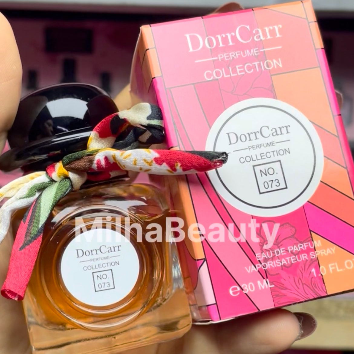 DorrCarr perfume bottle and packaging held by a person