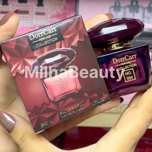 Dor Carr perfume bottle and packaging held by a person with 'Milha Beauty' branding.