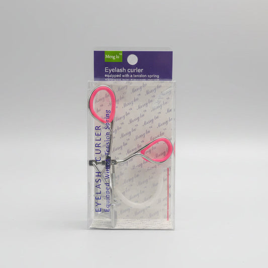 A packaged eyelash curler set with pink-handled tools and a clear plastic sleeve, placed on top of a black laptop keyboard.