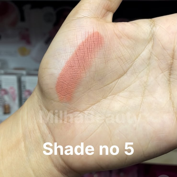 A close-up of a hand showing a swatch of a dusty rose pink cosmetic cream on the back of the palm, with text overlays indicating 'Shade no 5' and 'Price 150/- each'.