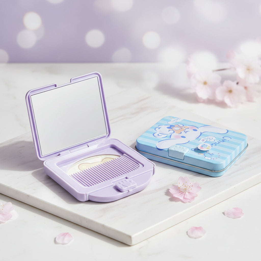 A lavender compact mirror set with a cartoon bear comb and a matching blue striped case, displayed on a patterned fabric background.