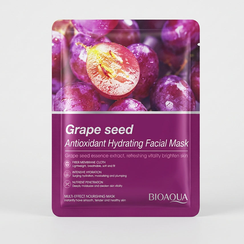 A packet of RIMOKUA Grape seed Antioxidant Hydrating Facial Mask, featuring a purple grape design, placed on a beige patterned fabric surface.