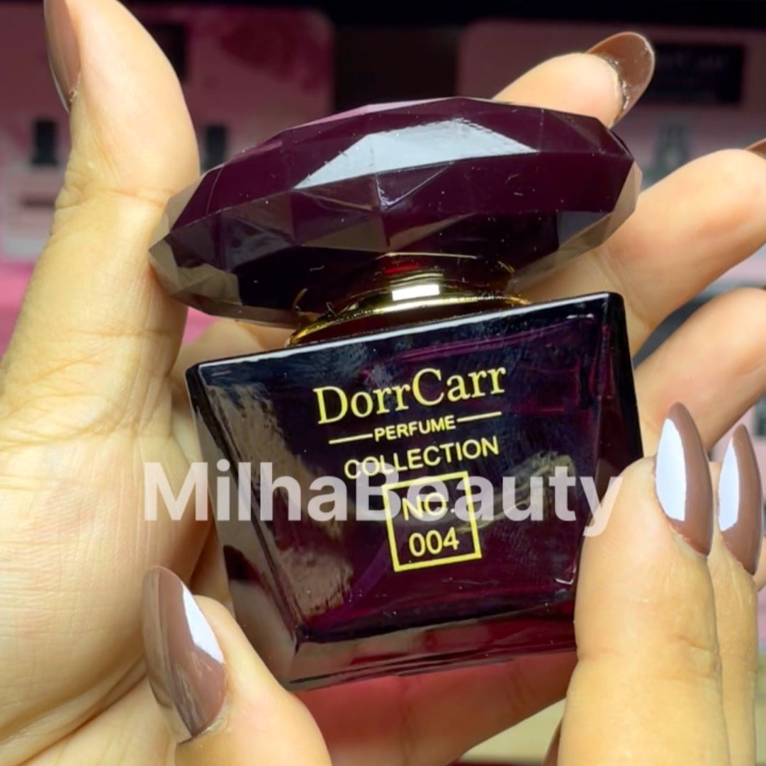 Perfume bottle with 'DorrCarr' branding held by a hand