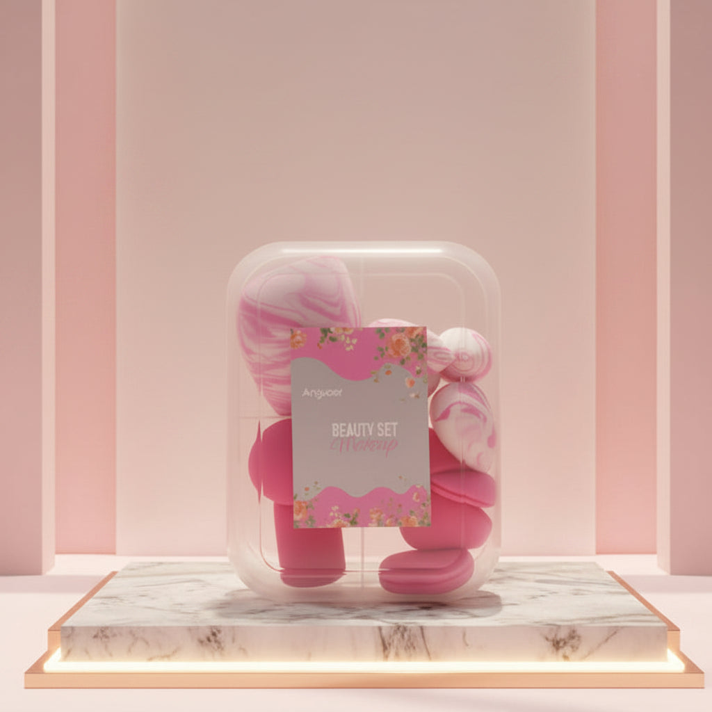 Pink beauty sponge and makeup brush set displayed in a clear round container with a floral label, floating above a marble pedestal against a soft pink studio background.