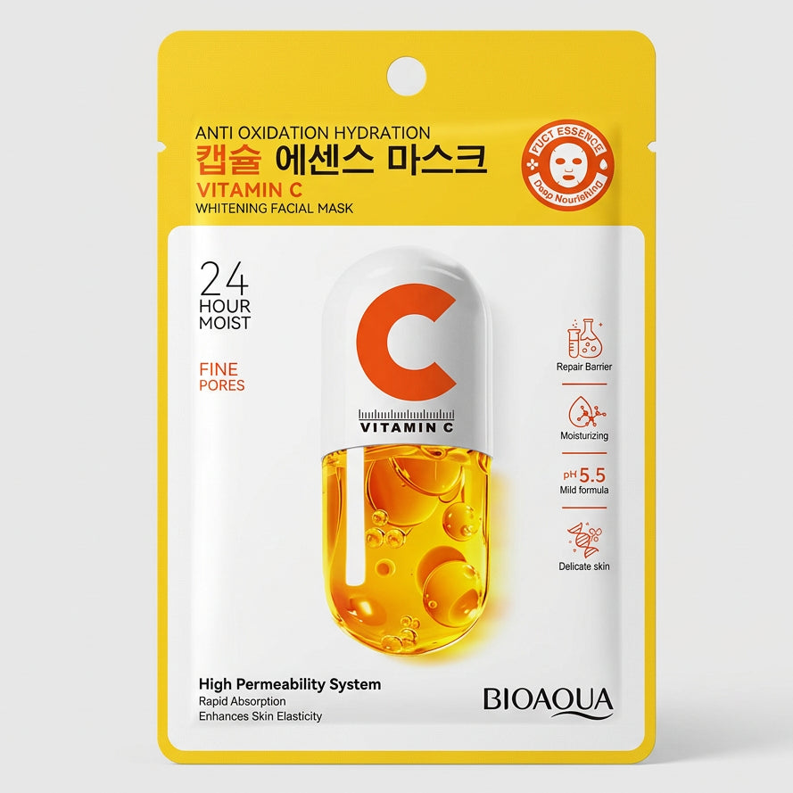 BIOAQUA Vitamin C Whitening Facial Mask in a yellow and white blister pack, placed on a dark keyboard surface.