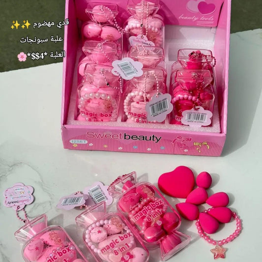 Pink toy set with 'sweet beauty' packaging on a white surface