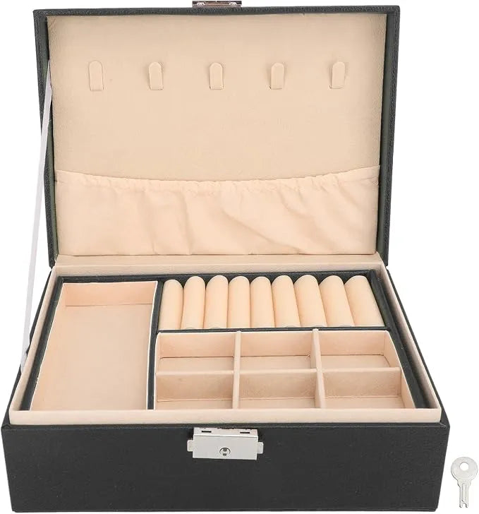 An open black jewelry organizer box with a beige velvet interior, featuring compartments, roll holders, and a key in the lock. A small key graphic is shown in the bottom right corner.