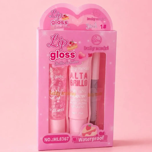 A pink retail display box containing three lip gloss tubes, labeled 'Lip gloss Collection' and 'Alta Brillo', on a solid pink background.