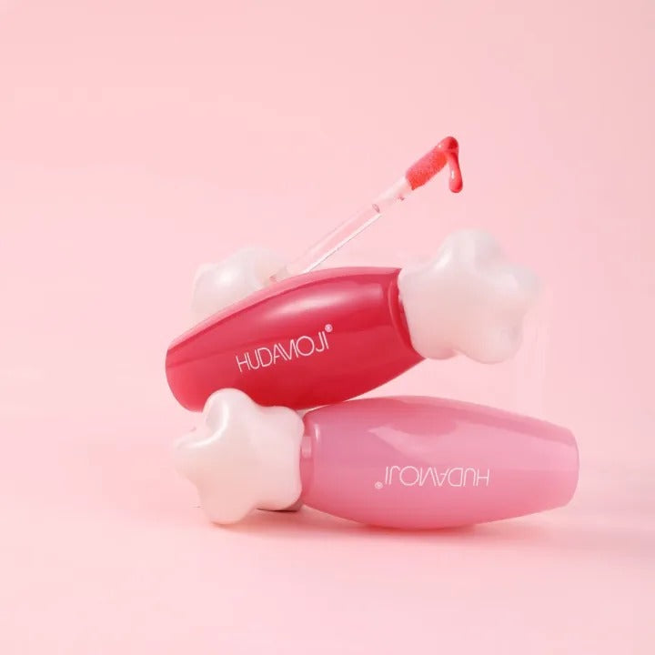 Pink and white beauty device with 'HUDAMOJI' branding on a pink background