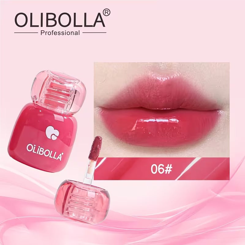 Olibolla lip gloss with applicator and close-up of lips wearing the product on a pink background.