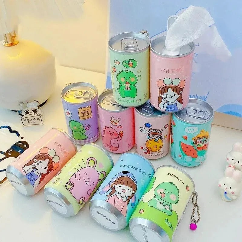Collection of colorful cartoon-themed cans on a light surface.