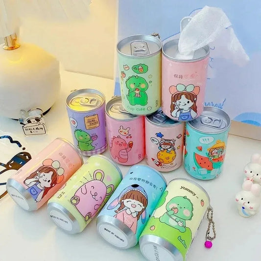 Collection of colorful cartoon-themed cans on a light surface.
