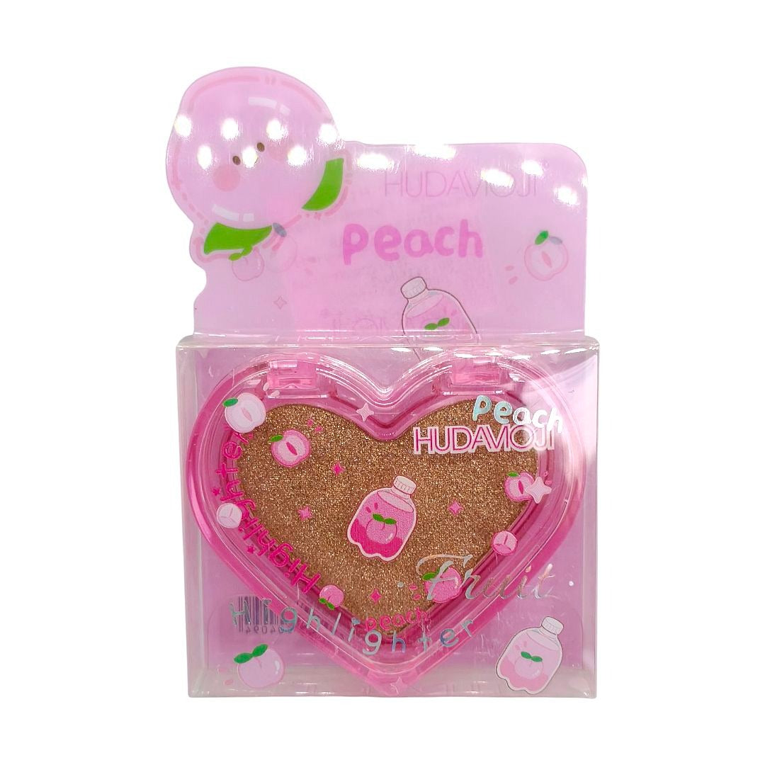 A heart-shaped pink compact with gold glitter inside, packaged in a clear plastic box with a pink backing card featuring a peach character and the text 'Peach HUDAMOJI'.