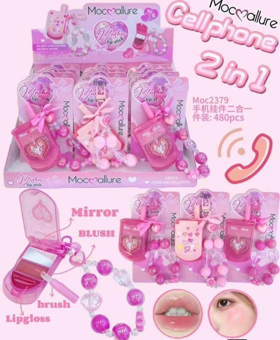 Pink 2-in-1 mobile phone lip gloss toy set by Moccallure, featuring a toy phone with a mirror, blush, lip gloss brush, and heart-shaped beads, shown in a retail display box and product detail layout.