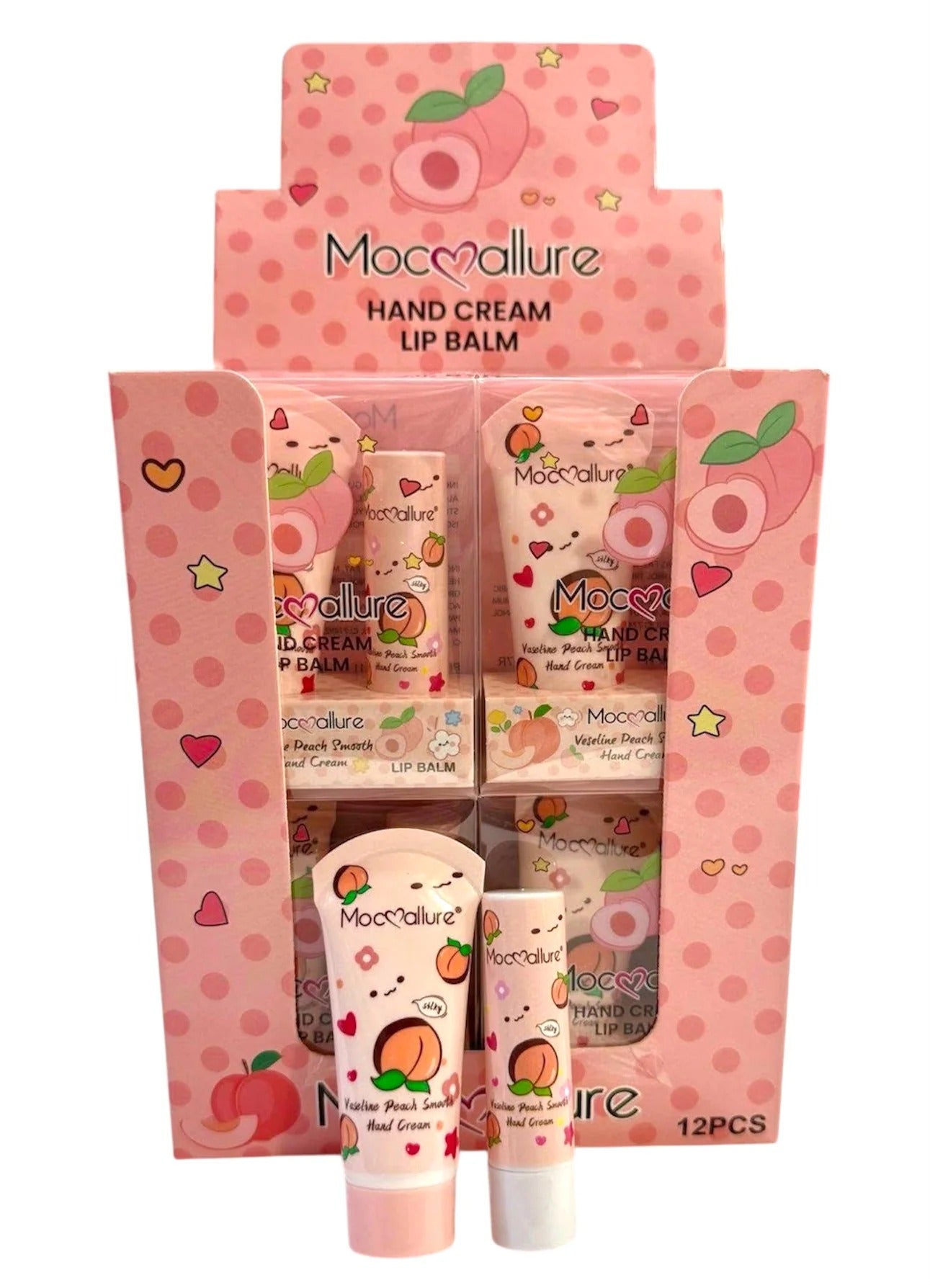 Mococallure Hand Cream Lip Balm display set in a pink box with matching tubes and single tubes in front, decorated with peach and heart illustrations on a white background.