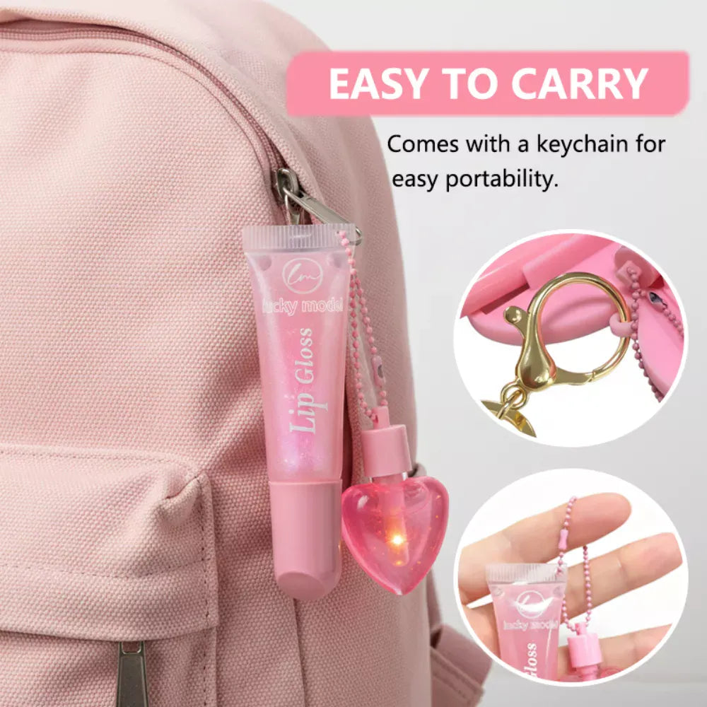 Pink lip gloss keychain bag charm clipped to a light pink backpack, with text reading 'EASY TO CARRY' and two circular inset close-ups showing the keychain clasp and the product held in a hand.