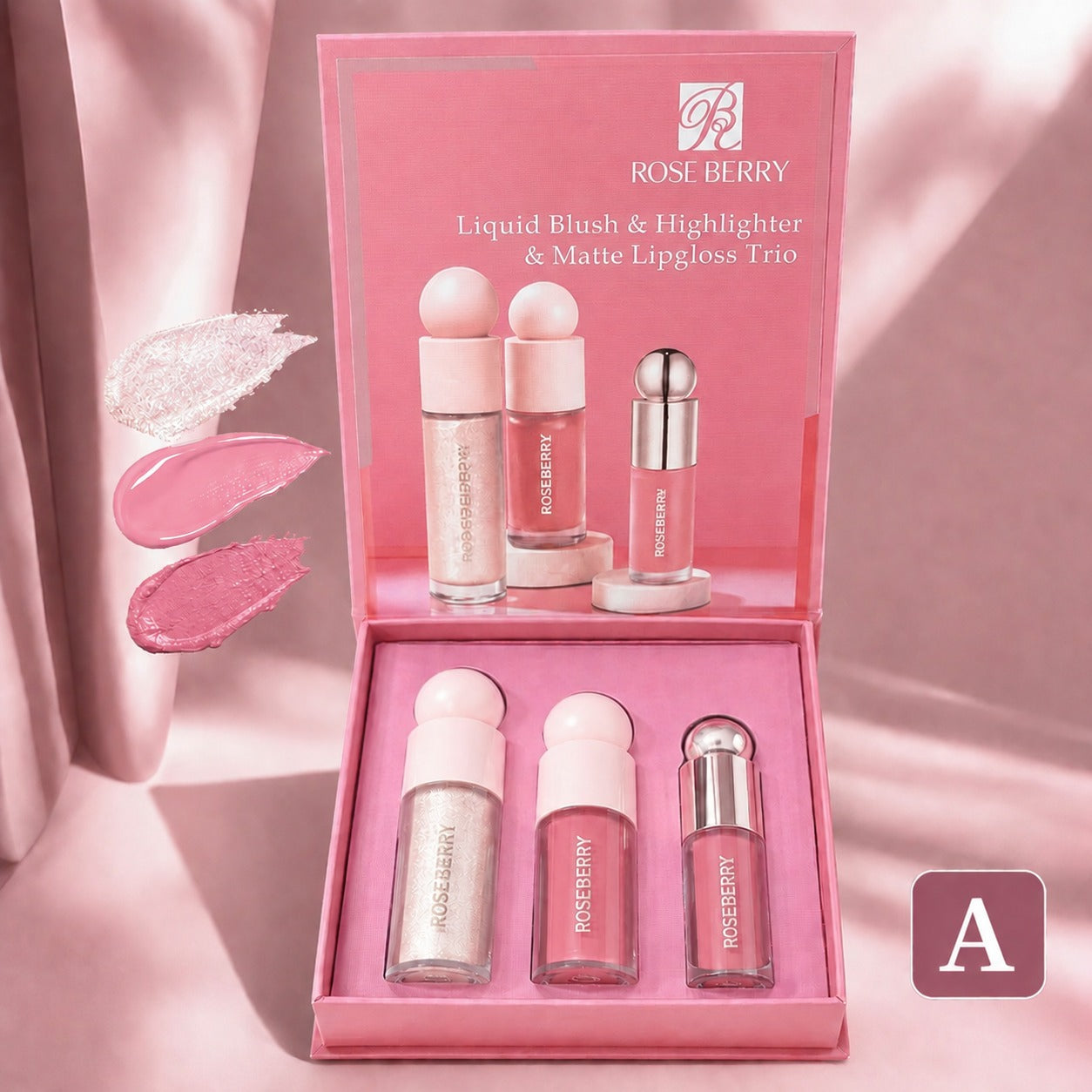 Rose Berry Liquid Blush & Highlighter & Matte Lipgloss Trio in a pink presentation box, with three lip products displayed inside and three pink shimmer swatches shown on the left against a soft pink draped background.
