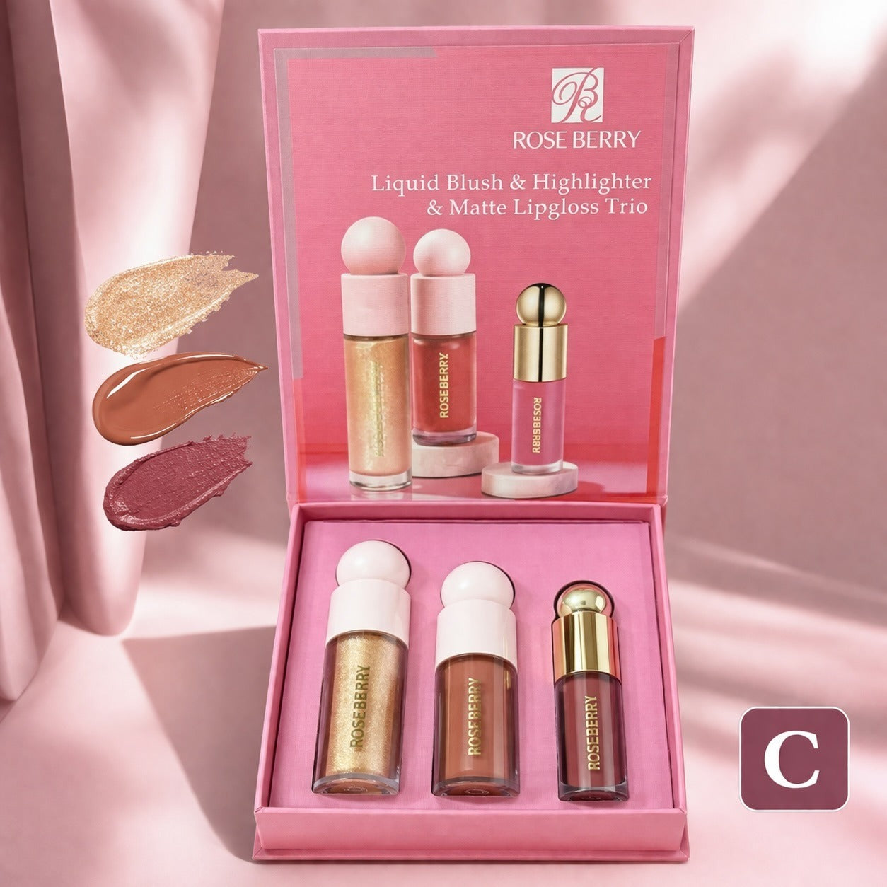 Rose Berry Liquid Blush & Highlighter & Matte Lipgloss Trio in a pink presentation box, with three cosmetic tubes displayed inside and three color swatches shown on the left against a soft pink draped background.