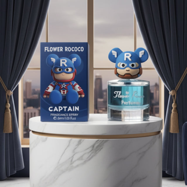 Flower Rococo Captain fragrance spray bottle and its blue retail box, featuring a cartoon Captain Marvel character with a blue helmet and mask on the packaging and bottle label.