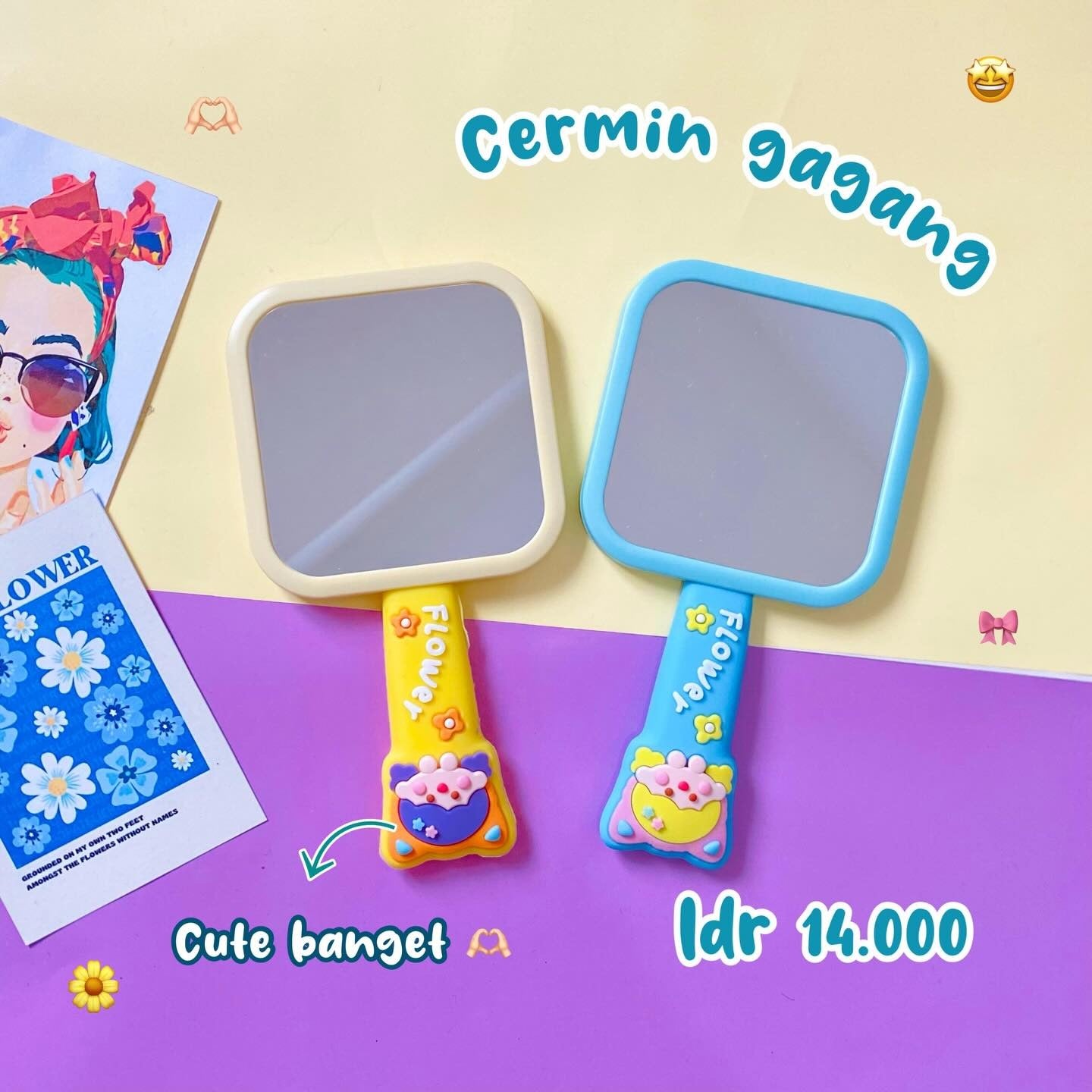 Two colorful hand mirrors with cartoon designs on a purple and beige background.