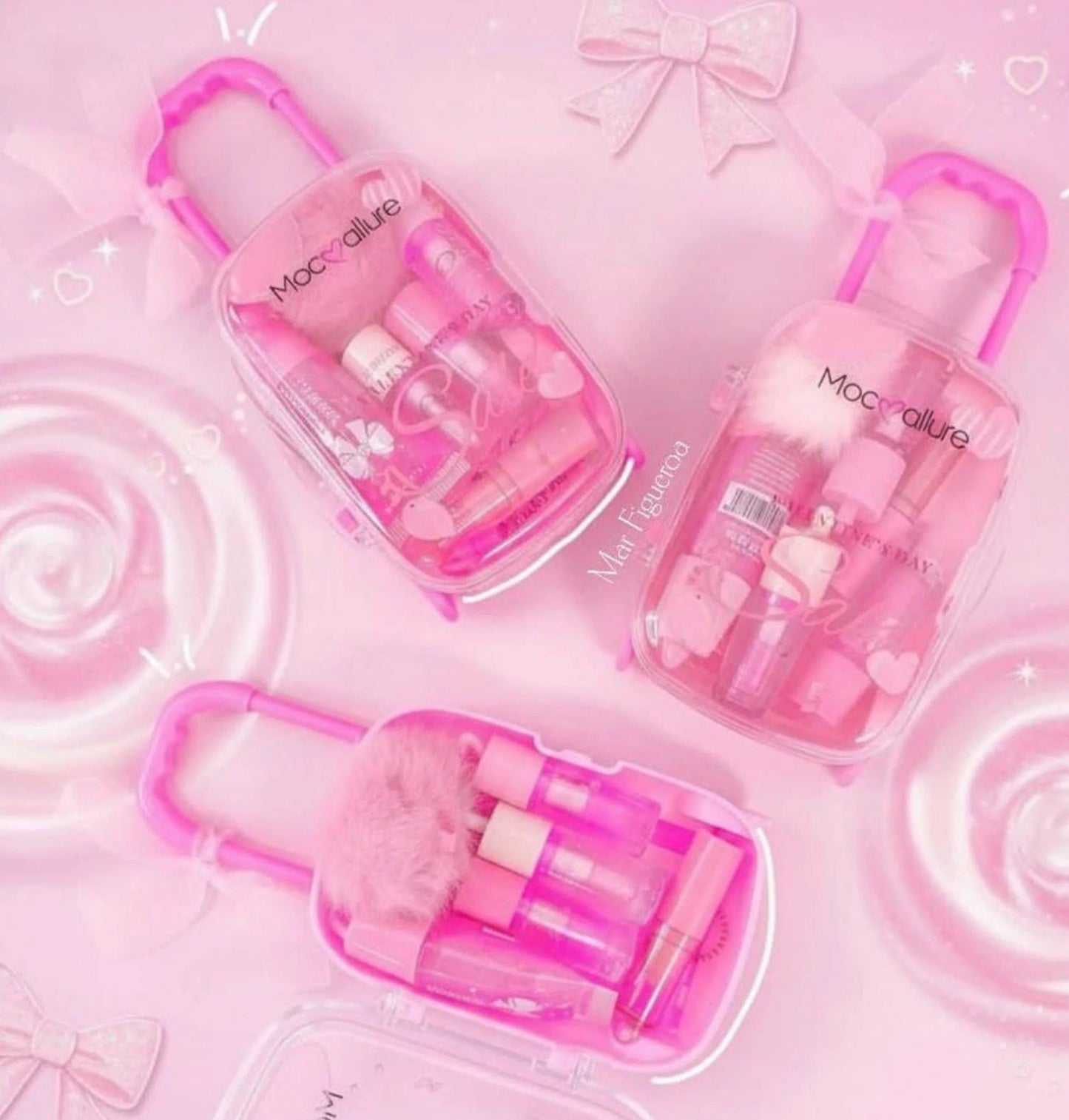 Set of pink cosmetic products with visible branding on a pink background