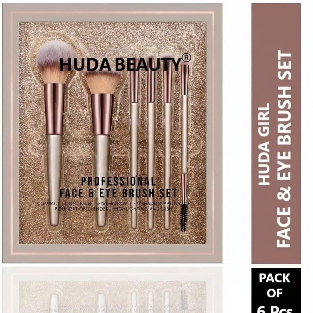 Huda Beauty professional face and eye brush set in a square presentation box, featuring six makeup brushes with rose gold ferrules and silver handles on a glittery gold background. A vertical sidebar on the right reads 'HUDA GIRL FACE & EYE BRUSH SET' and 'PACK OF 6 Pcs.