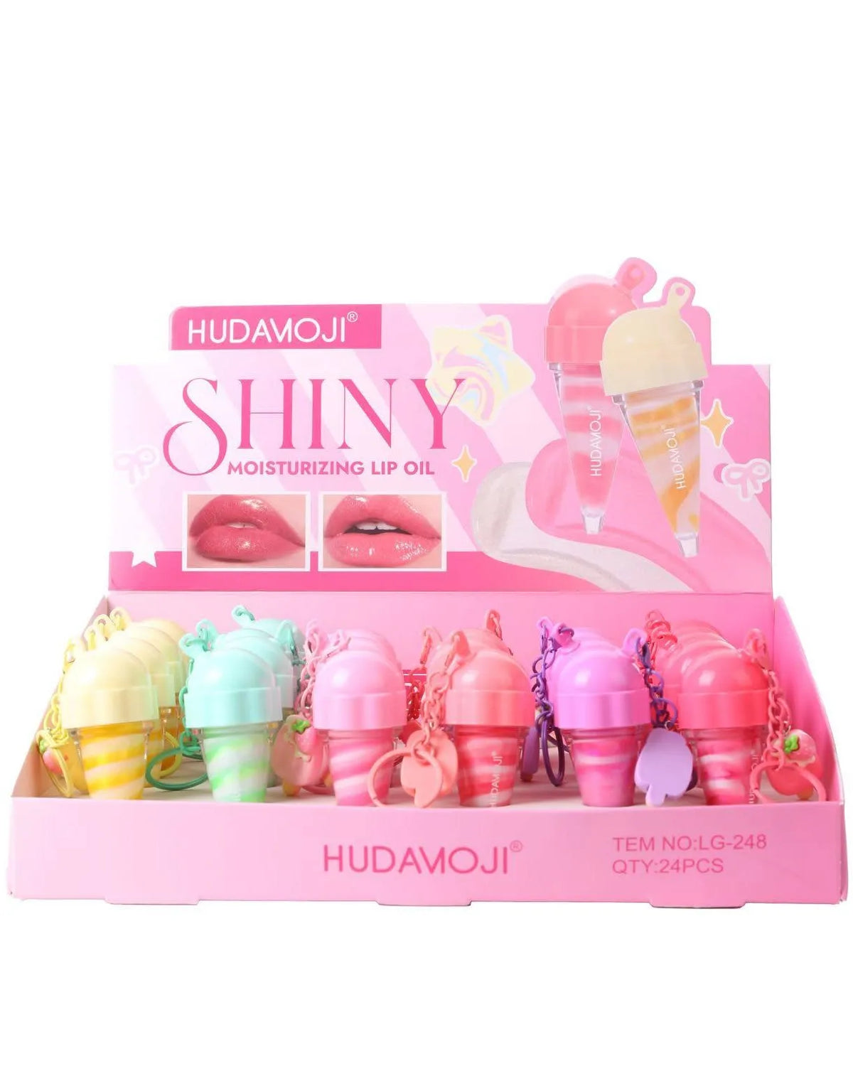 A pink display box of Hudamoji Shiny Moisturizing Lip Oil, containing multiple small lip oil bottles in pastel colors like yellow, mint green, pink, and purple, arranged on a white background.