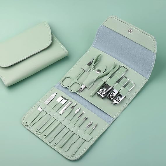 Manicure set with tools in a green case on a light green background