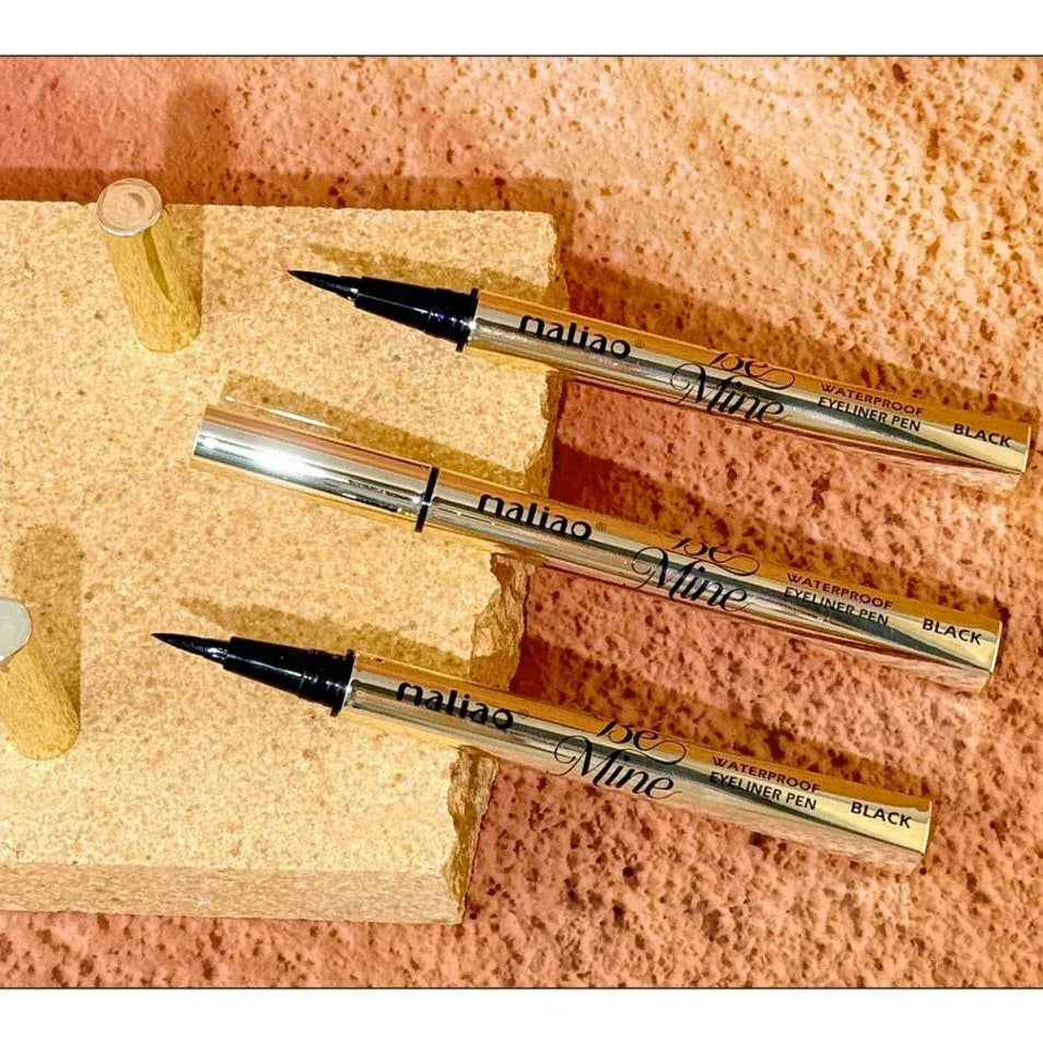 Set of calligraphy pens on a textured surface