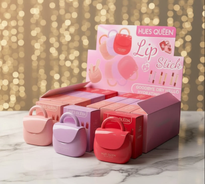 Hues Queen lip and stick packaging on a marble surface