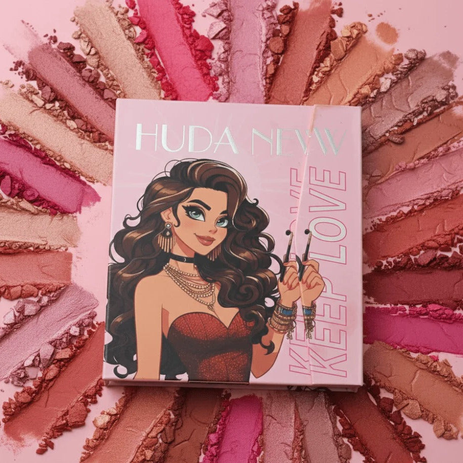 Huda Beauty makeup palette with colorful swatches on a pink background