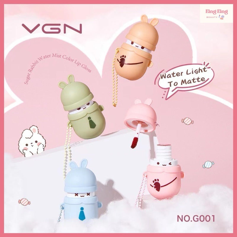 VGN water mist color lip glosses in a cute cartoon rabbit character design, shown in pastel pink, peach, green, blue, and pink colors on a pink background with clouds and heart graphics.