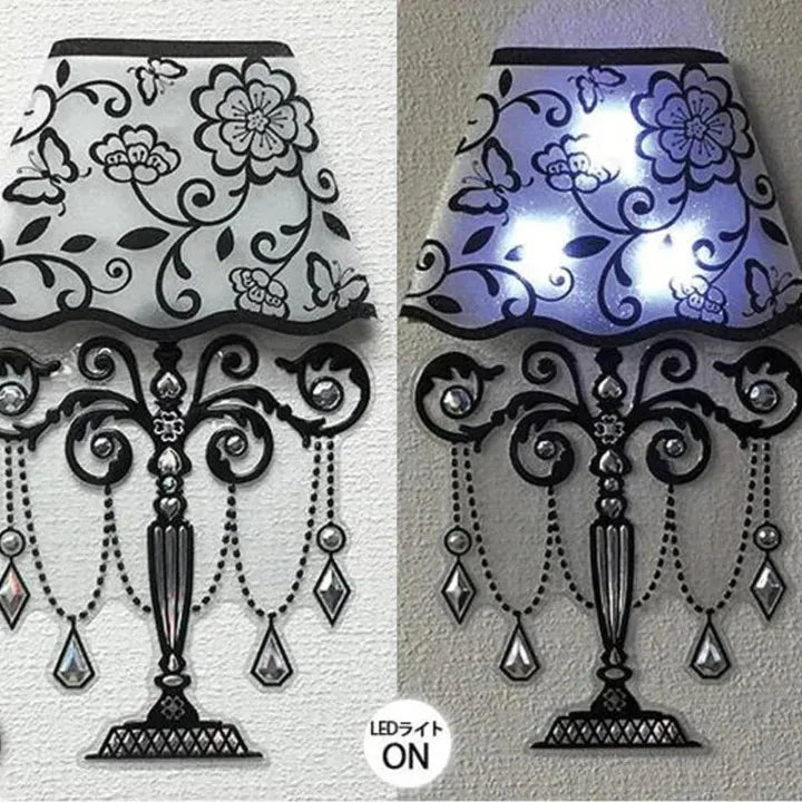 Decorative wall lamp with floral and butterfly patterns, shown on a white background.