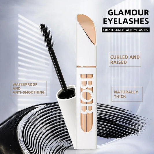 Eyelash product with applicator and packaging on a white background