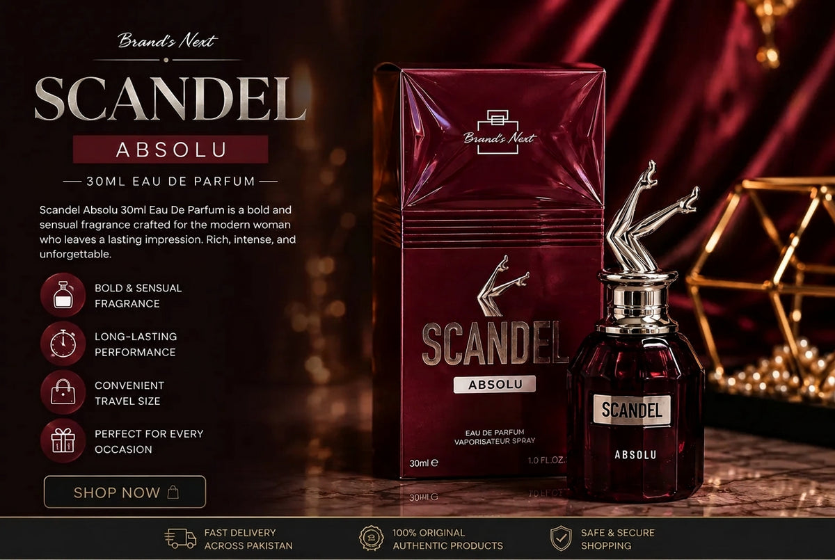 Scent Siege Brand's Next Scandal Absolu 30ml Eau De Parfum bottle and its matching box, displayed on a dark wooden surface with a warm, atmospheric background of red drapery and gold geometric decor.