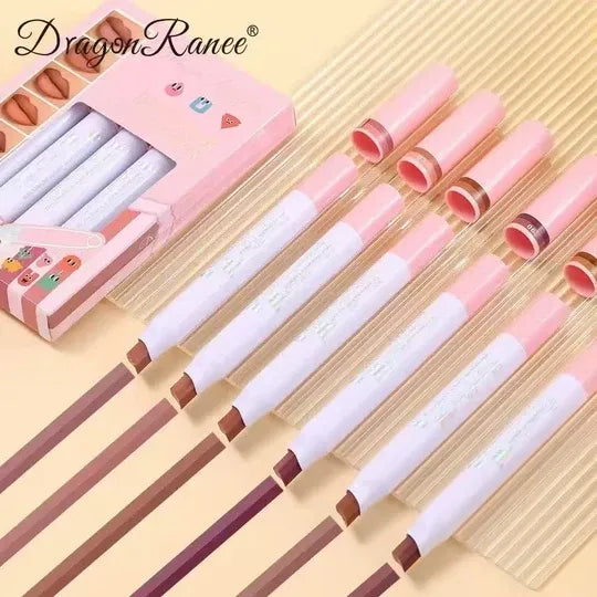 A set of lip liner pencils in various nude shades, shown with their pink caps off and arranged diagonally next to their pink packaging box. The brand name 'Dragon Ranee' is visible in the top left corner.