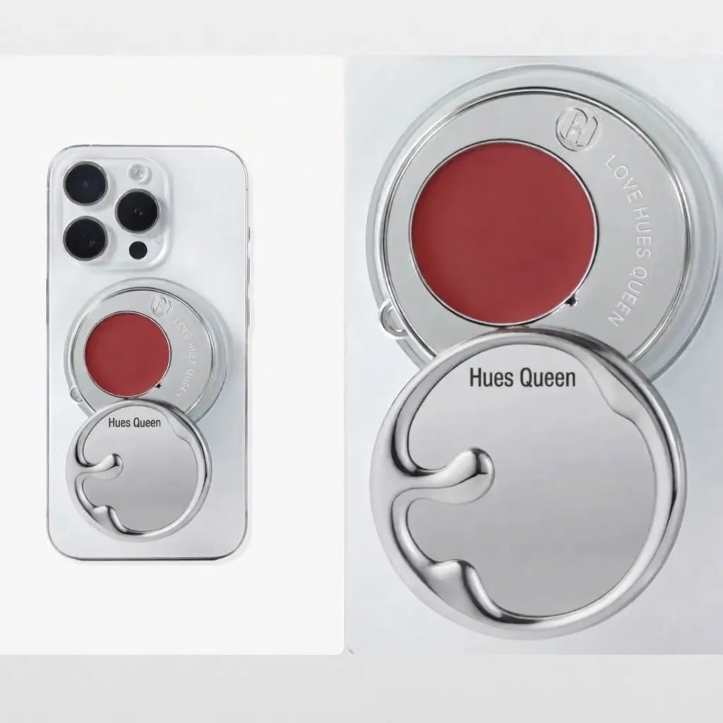 A Hues Queen brand silver magnetic phone case shown on a white phone, alongside close-up views of the circular silver case components revealing a red pressed powder blush or lip color insert. The case includes engraved text reading 'Hues Queen' and 'LOVE HUES QUEEN'.