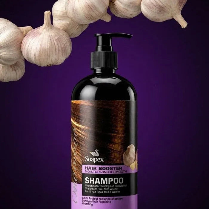 A bottle of Soapfi Hair Booster Shampoo with a black pump and a purple label, set against a dark purple background with a decorative garland of garlic bulbs.