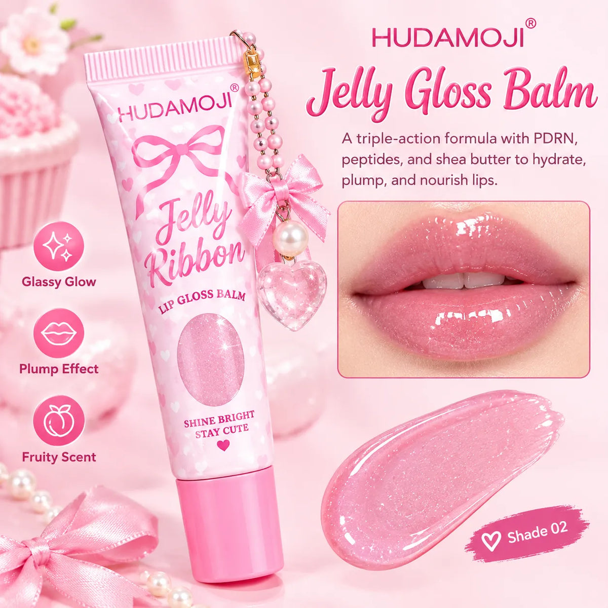 HUDAMOJI Jelly Gloss Balm lip gloss tube in pink with a charm, shown alongside a close-up of glossy pink lips, a smear of the pink gloss, and feature icons for 'Glossy Glow', 'Plump Effect', and 'Fruity Scent' on a soft pink background.