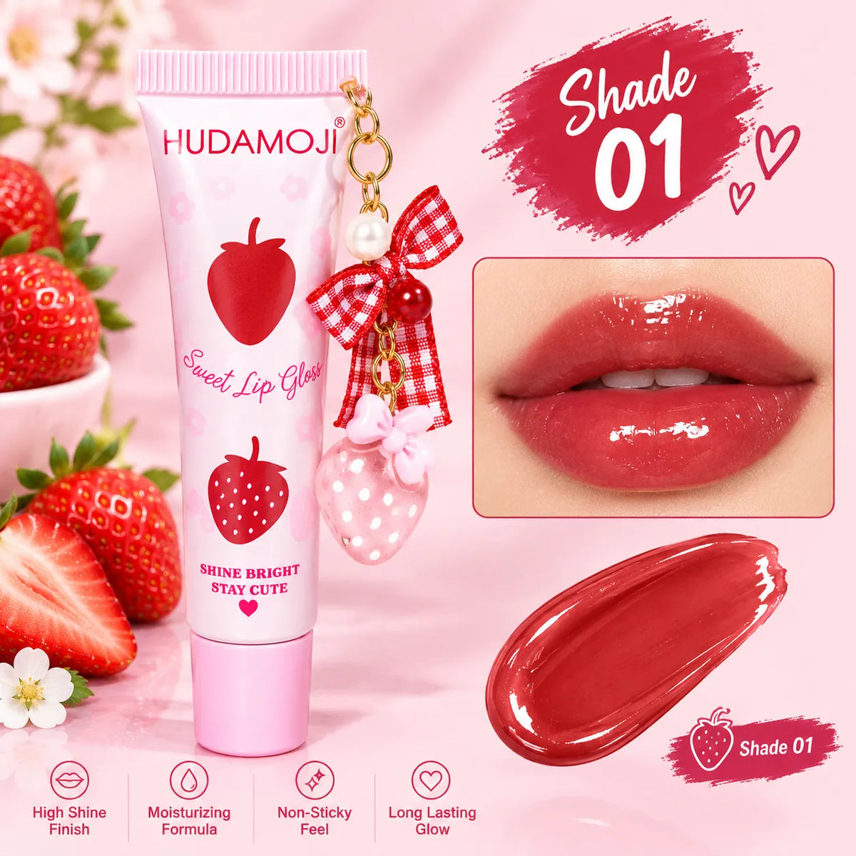 Hudamoji Strawberry Sweet Lip Glow tube in Shade 01, shown with a strawberry-themed keychain charm on a pink background with strawberry props, a lip application inset, a product swatch smear, and feature icons.