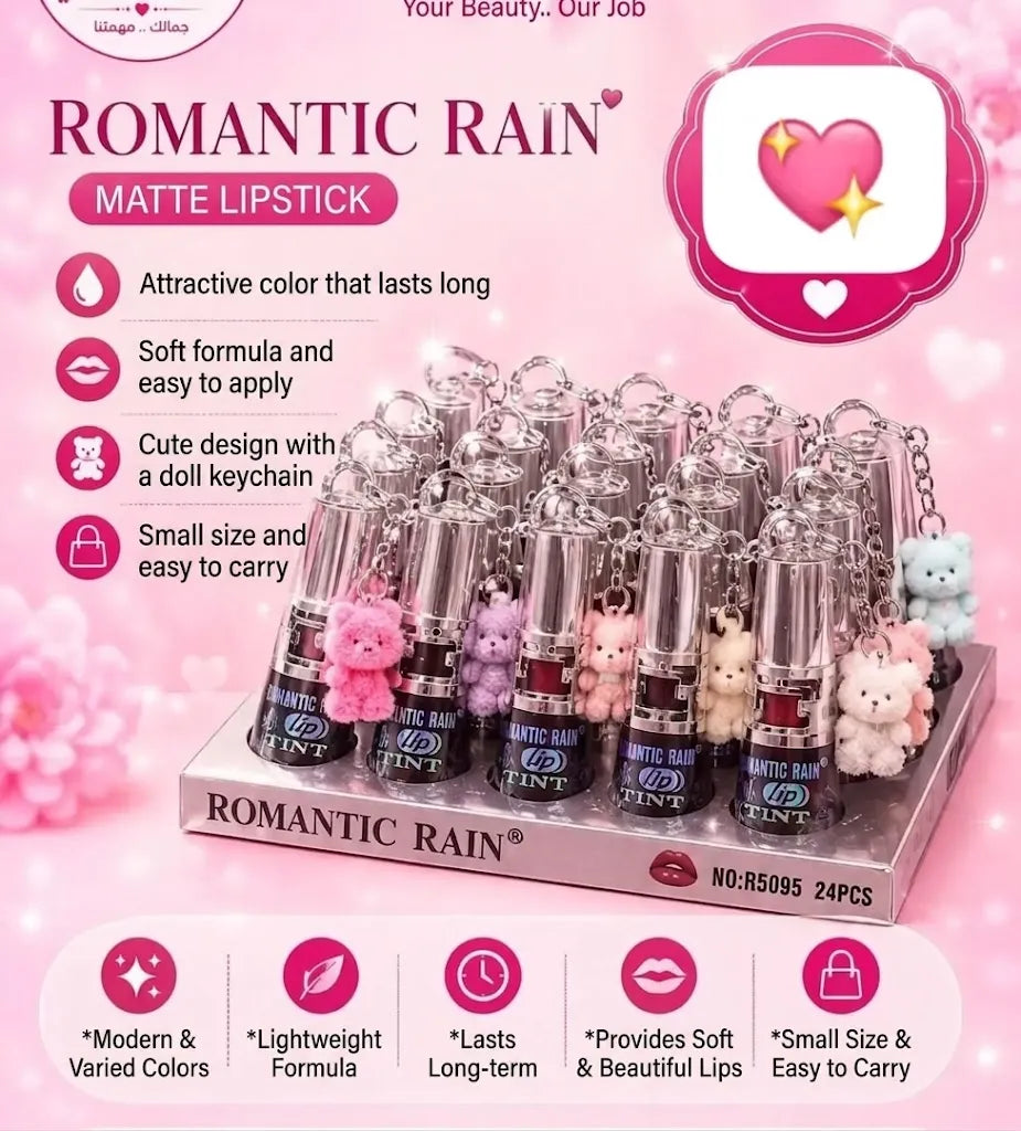 A pink promotional display for a 24-pack of 'Romantic Rain' matte lipstick lipsticks in assorted pastel colors, each with a small teddy bear keychain attached. The image features marketing text, icons, and a pink floral background.