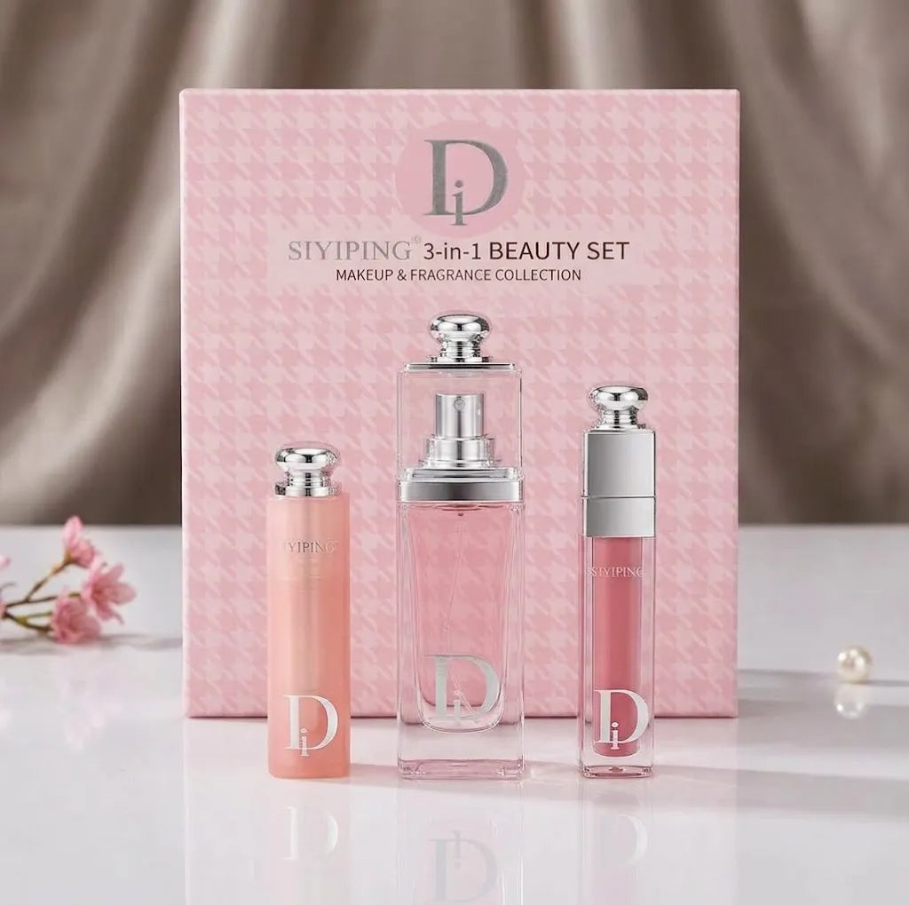 A 3-in-1 beauty set by Stiyiping, featuring a pink patterned box and three matching cosmetic bottles in pink and peach tones with silver caps, displayed on a reflective white surface.