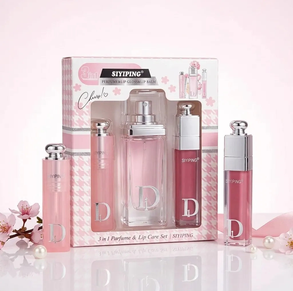 A pink and white Sifying perfume and lip care set displayed in its retail box, with four bottles arranged in front on a reflective surface against a soft pink background.