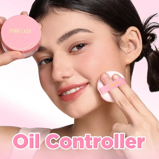 A woman applies a pink oil-controlling powder from a round pink compact labeled 'PINKFLASH' while holding a white puff with a pink band. Large pink text at the bottom reads 'Oil Controller' against a soft pink background.